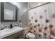 Updated bathroom featuring a modern vanity, sink, and shower with decorative curtain at 1716 Wild Indigo Ter, Oviedo, FL 32766