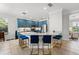Modern kitchen with marble countertops, stainless steel appliances, and blue cabinets at 1716 Wild Indigo Ter, Oviedo, FL 32766