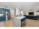 A kitchen with marble countertops, stainless steel appliances, blue cabinets, and an open floor plan at 1716 Wild Indigo Ter, Oviedo, FL 32766