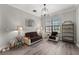 Bright living room with a comfortable sofa, side tables, and natural light at 1716 Wild Indigo Ter, Oviedo, FL 32766