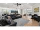 An open floor plan with a living room, dining room, and kitchen at 1716 Wild Indigo Ter, Oviedo, FL 32766