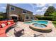 Beautiful backyard pool and spa with brick patio and outdoor furniture for lounging and entertaining in a private backyard at 1716 Wild Indigo Ter, Oviedo, FL 32766