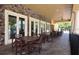 Outdoor patio area with tables and chairs, ideal for gathering and socializing at 1716 Wild Indigo Ter, Oviedo, FL 32766