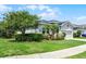 Attractive single-Gathering home with lush landscaping, and a well-maintained lawn at 17200 Gathering Place Cir, Clermont, FL 34711