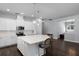 Spacious kitchen with large center island, pendant lighting, and stainless steel appliances at 17200 Gathering Place Cir, Clermont, FL 34711
