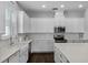 Gourmet kitchen with stainless steel appliances, farmhouse sink, and custom cabinetry at 17200 Gathering Place Cir, Clermont, FL 34711