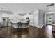 Spacious kitchen features a large island with barstool seating, stainless steel appliances and white cabinetry at 17200 Gathering Place Cir, Clermont, FL 34711