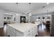 Bright kitchen features a large center island, stainless appliances, and open floorplan at 17200 Gathering Place Cir, Clermont, FL 34711