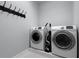 Laundry room view with a modern washer and dryer set at 17200 Gathering Place Cir, Clermont, FL 34711