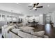 Bright living room flows seamlessly into the kitchen, creating an inviting gathering space at 17200 Gathering Place Cir, Clermont, FL 34711
