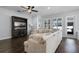 Comfortable living room with a large sectional sofa, media center and lots of light at 17200 Gathering Place Cir, Clermont, FL 34711