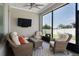 Screened in patio with comfortable seating and an outdoor view at 17200 Gathering Place Cir, Clermont, FL 34711