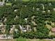 Areal view of a tree covered property showing multiple homes and structures at 183 Parsons Rd, Longwood, FL 32779