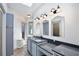 Bright bathroom features dual sinks, vanity, and ample cabinet space at 183 Parsons Rd, Longwood, FL 32779