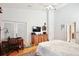 Bright bedroom with vaulted ceilings, wood floors, and a charming desk area near French doors at 183 Parsons Rd, Longwood, FL 32779