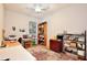Cozy bedroom with ceiling fan and window offering natural light and a large area rug at 183 Parsons Rd, Longwood, FL 32779