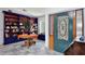 Elegant entryway featuring a stained-glass door and a custom bookcase at 183 Parsons Rd, Longwood, FL 32779