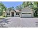 Charming single-story home with a wide driveway and well-maintained landscaping at 183 Parsons Rd, Longwood, FL 32779