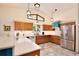 Well-lit kitchen with modern appliances, quartz countertops, and custom cabinetry at 183 Parsons Rd, Longwood, FL 32779