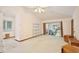 Open concept living room with neutral carpet, ceiling fan, and sliding glass door to the backyard at 183 Parsons Rd, Longwood, FL 32779