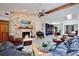 Open-concept living room with stone fireplace, tile floors, and custom shelving at 183 Parsons Rd, Longwood, FL 32779