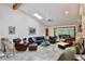 Cozy living room with vaulted ceiling, stone fireplace, and tile flooring at 183 Parsons Rd, Longwood, FL 32779