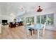 Open concept living room and dining area with hardwood floors and lots of natural light at 183 Parsons Rd, Longwood, FL 32779