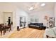Comfortable living room with hardwood floors, a ceiling fan, and access to the exterior through sliding glass doors at 183 Parsons Rd, Longwood, FL 32779