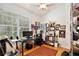 Functional home office with a desk, shelving, and a window for natural light at 183 Parsons Rd, Longwood, FL 32779