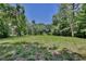 Spacious property with lush green grass and mature trees, offering a serene and private environment at 183 Parsons Rd, Longwood, FL 32779