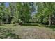 Expansive green property surrounded by lush trees at 183 Parsons Rd, Longwood, FL 32779