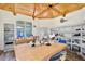 Light-filled studio with custom shelving, hardwood floors and geometric wood plank ceiling at 183 Parsons Rd, Longwood, FL 32779