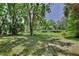 Lush green yard with mature trees offering shade and privacy in a serene setting at 183 Parsons Rd, Longwood, FL 32779