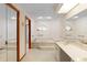 This elegant bathroom features a bathtub and sink with a large mirror at 2018 N Normandy Blvd, Deltona, FL 32725