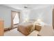 Comfortable bedroom with neutral tones, window views, and a ceiling fan at 2018 N Normandy Blvd, Deltona, FL 32725