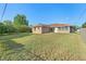 Lovely brick home situated on a well-kept lawn under a bright blue sky at 2018 N Normandy Blvd, Deltona, FL 32725