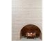 Close up on a white brick fireplace with a uniquely styled arched opening and decorative fire log at 2018 N Normandy Blvd, Deltona, FL 32725