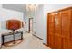 Foyer with tile floors, chandelier and wooden closet doors provides an elegant entryway at 2018 N Normandy Blvd, Deltona, FL 32725