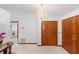 Bright foyer features tile flooring, closet, and view of the laundry room at 2018 N Normandy Blvd, Deltona, FL 32725