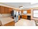Traditional-style kitchen with wood cabinets, stainless steel appliances, and tile flooring at 2018 N Normandy Blvd, Deltona, FL 32725