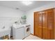 Functional laundry room with washer, dryer, utility sink, and closet at 2018 N Normandy Blvd, Deltona, FL 32725