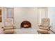Bright living room highlighting a decorative fireplace and two comfortable recliners at 2018 N Normandy Blvd, Deltona, FL 32725