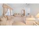 This living room features light colored walls and neutral decor with ample seating at 2018 N Normandy Blvd, Deltona, FL 32725