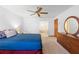 This primary bedroom features neutral carpet, large windows, and an ensuite bathroom at 2018 N Normandy Blvd, Deltona, FL 32725