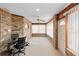 Bright sunroom features brick walls, a ceiling fan, and lots of windows at 2018 N Normandy Blvd, Deltona, FL 32725
