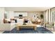 Open-concept living room and dining room with modern furnishings and decor at 2025 Forage Dr, Kissimmee, FL 34746
