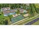 Aerial shot featuring tennis courts, playground, and community amenities at 2040 Royal Bay Blvd # 31, Kissimmee, FL 34746