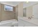 Nicely remodeled bathroom featuring decorative tile, vanity, and a shower at 2040 Royal Bay Blvd # 31, Kissimmee, FL 34746