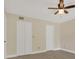 Bedroom featuring a closet, ceiling fan, and tile flooring at 2040 Royal Bay Blvd # 31, Kissimmee, FL 34746