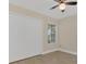 Cozy bedroom featuring a ceiling fan, closet, and ample lighting at 2040 Royal Bay Blvd # 31, Kissimmee, FL 34746